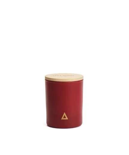 Glass filled with scented with apple, cinnamon, rose beeswax