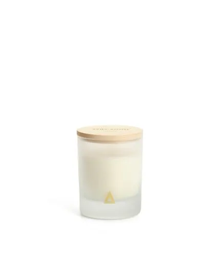 Glass filled with scented with fresh cotton and amber