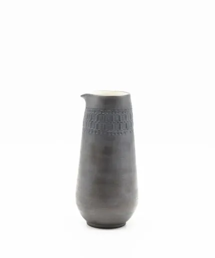 Handcrafted cylinder pitcher made of clay with embossed spathoto pattern