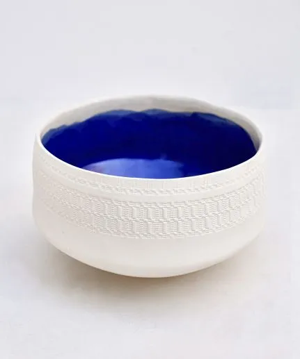 Handcrafted wide salad bowl made of clay with embossed spathoto pattern