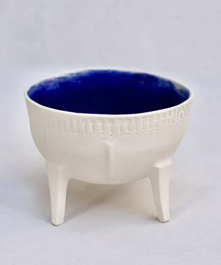 Handcrafted wide tripod bowl pitcher made of clay with embossed spathoto pattern