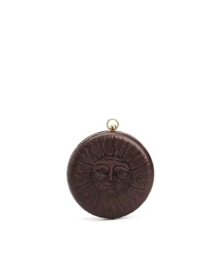 Leather clutch embossed with Sun and Moon designs and metallic frame