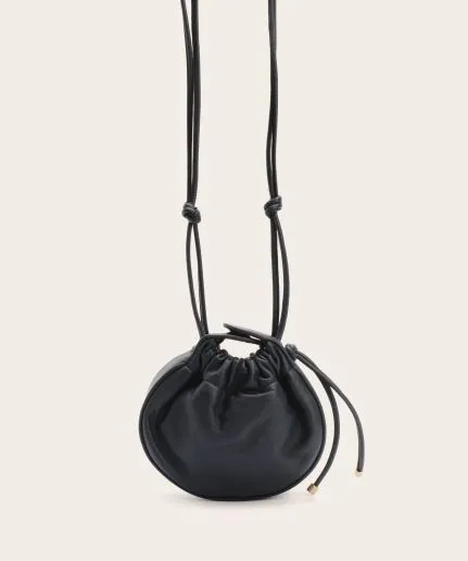 Mini circular leather shoulder bag with leather cord details