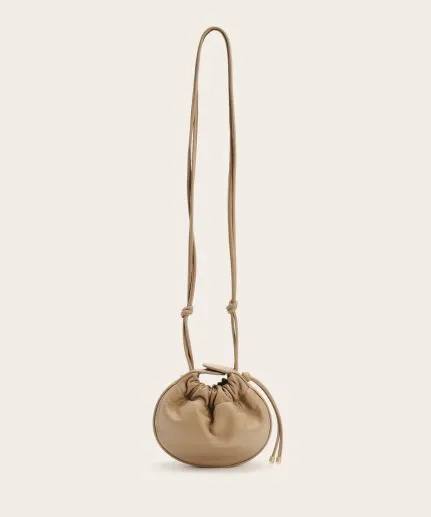 Mini circular leather shoulder bag with leather cord details