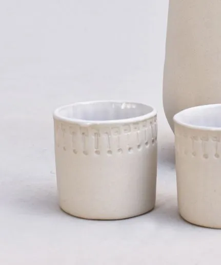 Set of 4 handcrafted small straight cups made of clay with embossed spathoto pattern.