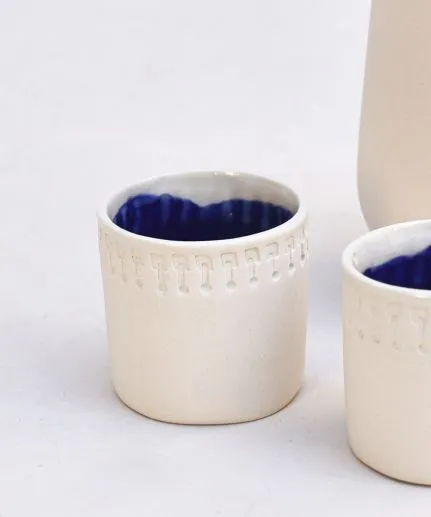 Set of 4 handcrafted small straight cups made of clay with embossed spathoto pattern.